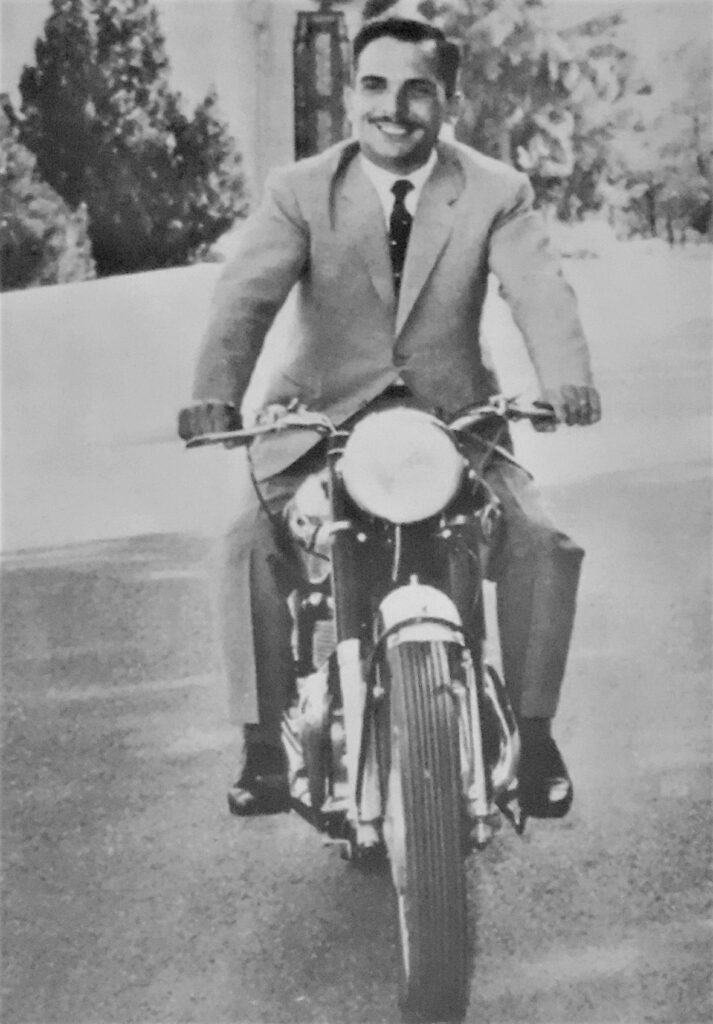 King Hussein of Jordan riding motorcycle